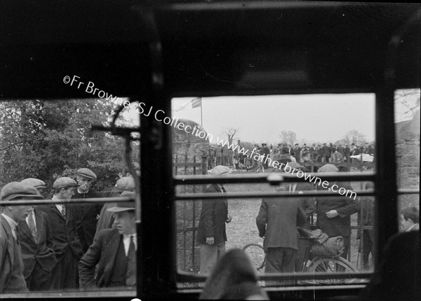 CROWD SCENE FROM BUS WINDOW